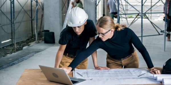 construction-workers-using-a-computer-on-a-job-site